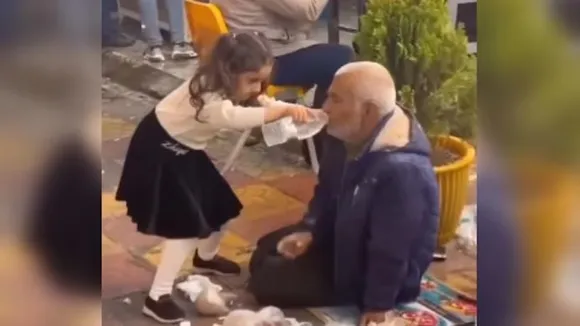 viral video, heartwarming video, little girl video, girl helps drink water"