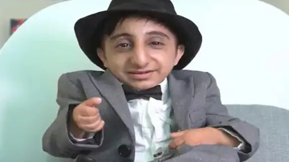 smallest person in world,world's shortest man,Shortest living man,worlds shortest man Afshin Esmaeil,20 year old worlds shortest man, worlds shortest man from Iran, worlds shortest man hight 2 feett 1.68 inch, who is worlds shortest man