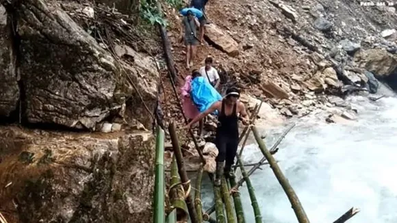 Arunachal Pradesh, Arunachal Pradesh’s Siang district, dying woman carried across treacherous terrain, express special, express premium, Indian Express, India news, current affairs