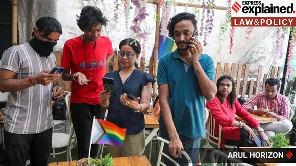 Members of LGBTQ community stay glued to the screens as they watch the live-stream of Supreme Court verdict at ‘Stories cafe’ at Koregaon Park, Pune. (Express photograph by Arul Horizon)