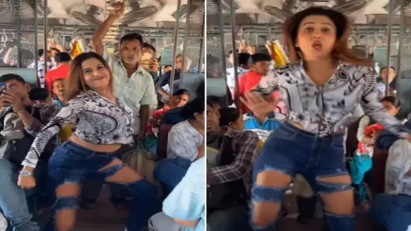 woman dances in train