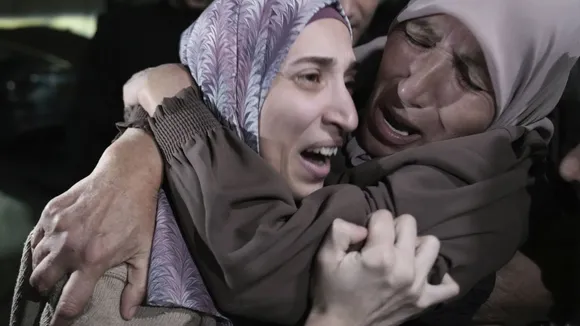 Released Palestinian woman Shurouq Duwiyat arrived at her home in Jerusalem where joyous family members hugged and kissed her.