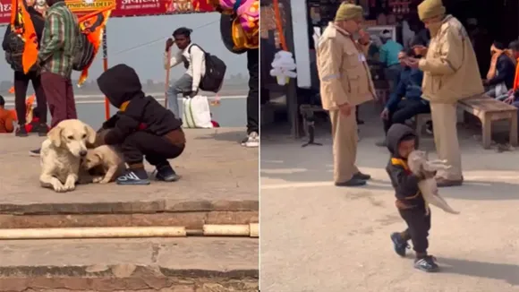Little boy plays with puppy, Ayodhya Sarayu bank, Ayodhya, Sarayu river, viral video, Adorable viral video, Adorable video, puppy video, Ayodhya news, dog lover, kids video, cute video, dog video, trending video