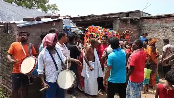After the death of old woman the cremation procession was followed by beating of drums