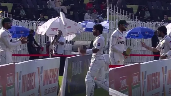 Mohammad Rizwan tosses bat at Babar Azam