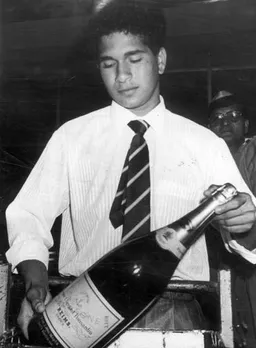 Sachin tendulkar with champagne bottle