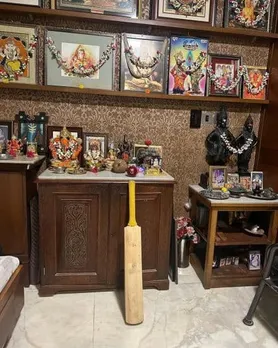 Sachin Tendulkar worshiping bat and ball with God in the home temple