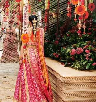anant ambani radhika merchant wedding date | anant ambani and radhika merchant marriage date | radhika merchant wedding dress looks | radhika merchant mameru dress cost | radhika merchant wedding dress price | radhika merchant | anant ambani | Mukesh ambani | nita ambani | ambani family wedding