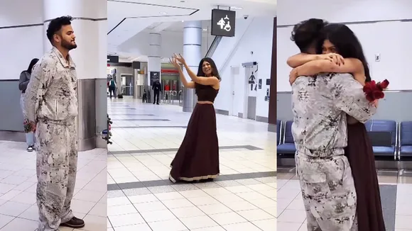 woman dances at airport