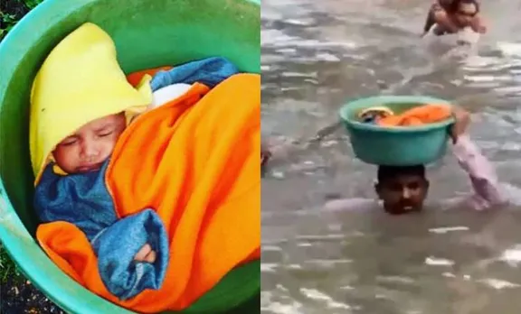 Police officer rescues baby,കുഞ്ഞ് പൊലീസ് ഉദ്യോഗസ്ഥന്‍, Vadodara Rain, വഡോദര മഴ,Cop Baby, Vadodara Police Officer, ie malayalam