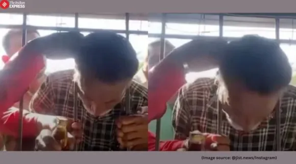 Mans head trapped in iron grill