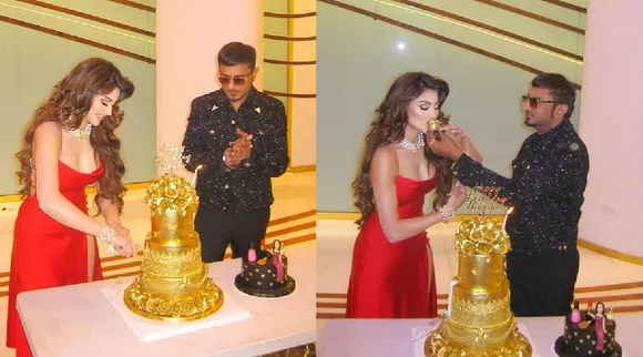 Urvashi Rautela cuts 24 carrot gold cake on her birthday Yo Yo Honey Singh gifts video goes viral Tamil News 