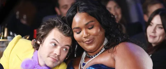 Lizzo Impersonates Harry Styles In a Hilarious TikTok, as The Two of Them Celebrate Being ‘At The Top of The Charts’