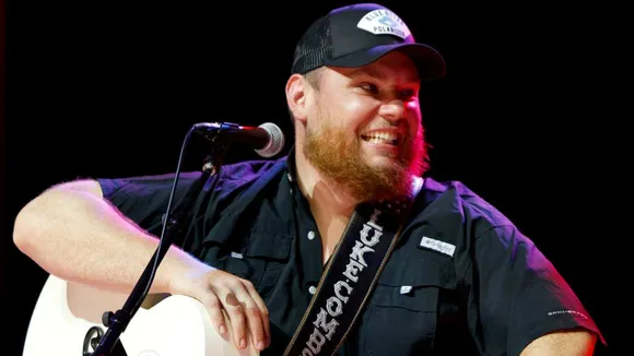 Glen Powell And 'Twisters' Cast Join Luke Combs on Stage For Beers at Country Concert