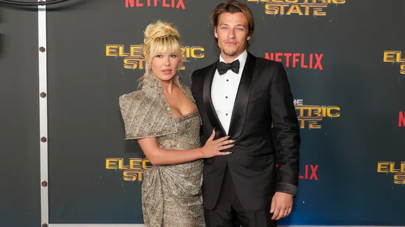 Millie Bobby Brown & Jake Bongiovi Stun in Glamorous Red Carpet Looks at ‘The Electric State’ Premiere