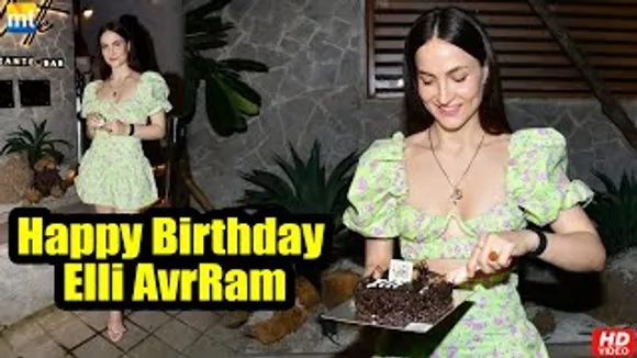 Ganapath Actress Elli AvrRam cuts her birthday cake with the paparazzi