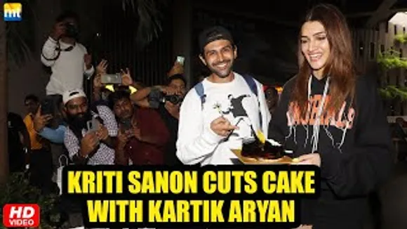 Kriti Sanon Cuts Birthday Cake with media at airport as she returns with Shehzada Kartik Aaryan