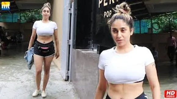 Neha Bhasin Flaunts Her Sexy Abs In White Tee And Black Shorts
