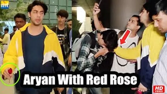Shah Rukh Khan's Son Aryan Khan returns with Red Rose in hand, fans Kisses Aryan hands
