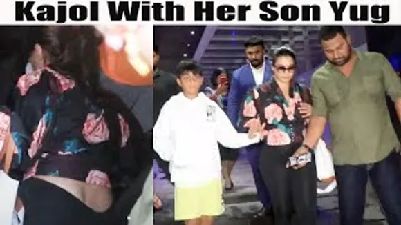 Kajol shields her son Yug while walking with security towards the car