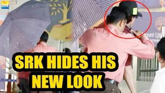 Jawan Shah Rukh Khan hides his new look from media as he arrives for Abram's Karate Match in BKC
