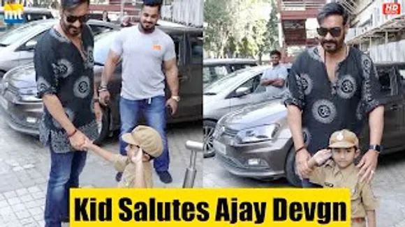 Ajay Devgn arrives at BHOLAA Teaser, kid Salutes Ajay Sir outside the theatre
