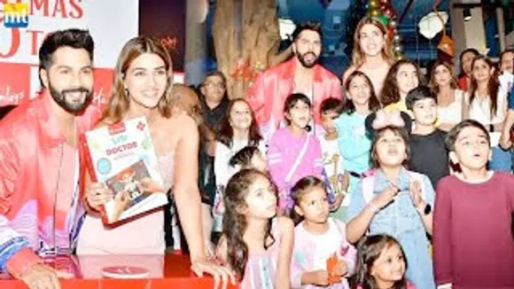 Varun Dhawan and Kriti Sanon bring early Christmas presents for the kids