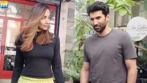 Malaika Arora glam up at salon for Christmas eve; Thadam Remake star Aditya Roy Kapur in Bandra