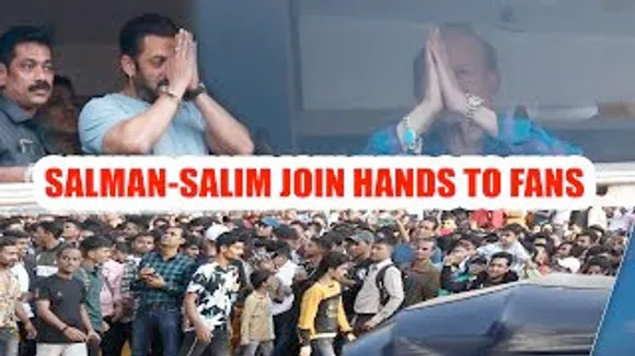 Salman Khan and his father Salim Khan join hands to the crowd gathered for his birthday