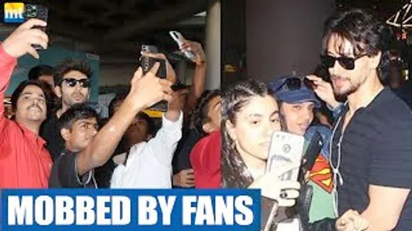Chote Miyan Tiger Shroff & Shehzada Kartik Aaryan get MOBBED by Fans at Airport to take Selfie