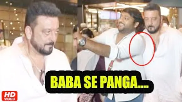 A Fan Tries to Hug Sanjay Dutt forcefully at the airport, See How he Pushed him away