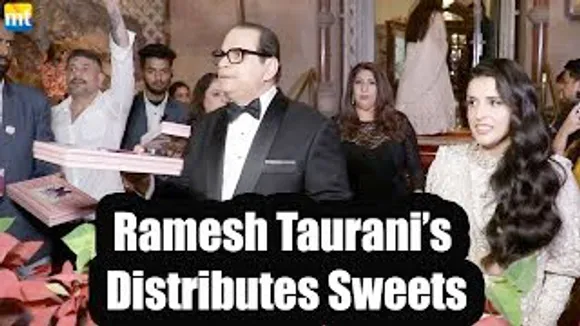 CROREPATI Filmmaker Ramesh Taurani distribute Sweets to Paps At Raveena Taurani's Wedding Reception