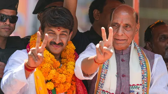 BJP candidate from North East Delhi constituency Manoj Tiwari with Union Defence Minister Rajnath Singh during a roadshow before he filed his nomination for Lok Sabha elections at Yamuna Vihar, in New Delhi, Wednesday, May 1, 2024