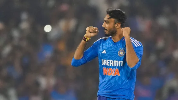 Indian bowler Axar Patel celebrates the wicket of Australian batter Travis Head during the fourth T20I match between India and Australia