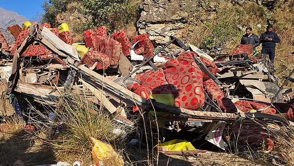 Wrecked remains of a bus which fell into a gorge while carrying passengers, in Doda district of Jammu & Kashmir