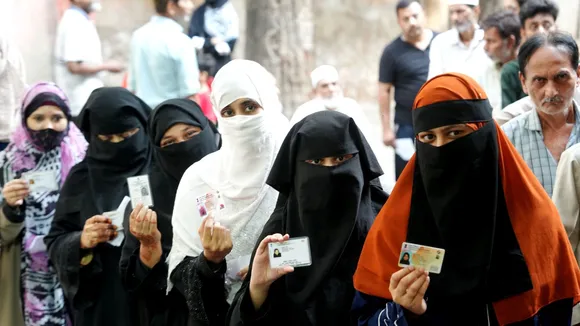 People wait in queues to cast their votes at a polling station during the fourth phase of Lok Sabha elections, in Kanpur, Monday, May 13, 2024