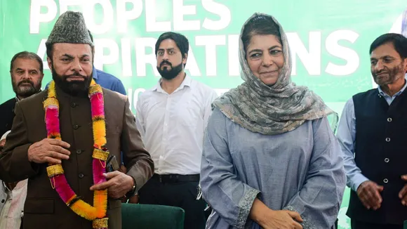 Peoples Democratic Party (PDP) President Mehbooba Mufti welcomes the senior separatist leader Saleem Gilani as he joins the party ahead of Assembly elections, in Srinagar, Sunday, Sept. 1, 2024.