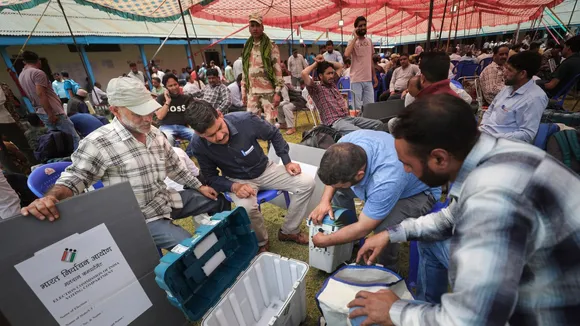 Polling officials check the election material at a distribution center before leaving for their respective polling booths on the eve of the sixth phase of Lok Sabha polls, in Rajouri district, Friday, May 24, 2024
