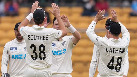 New Zealand's Matt Henry celebrates with teammates after taking the wicket of India's Ravindra Jadeja during the second day of the first Test cricket match between India and New Zealand, at M Chinnaswamy Stadium, in Bengaluru, Thursday, Oct. 17, 2024