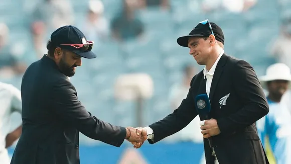 India's captain Rohit Sharma and New Zealand's captain Tom Latham during the toss before the start of the second test cricket match between India and New Zealand, at the Maharashtra Cricket Association Stadium, in Pune, Thursday, Oct. 24, 2024.
