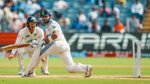 Virat Kohli being bowled by New Zealand's Mitchell Santner on the second day of the second test cricket match between India and New Zealand, at the Maharashtra Cricket Association Stadium, in Pune, Friday, Oct. 25, 2024.