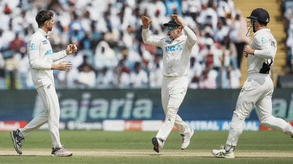 New Zealand's Mitchell Santner celebrates with captain Tom Latham and Will Young after taking the wicket of India's Yashasvi Jaiswal on the third day of the second test cricket match between India and New Zealand, at the Maharashtra Cricket Association Stadium, in Pune, Saturday, Oct. 26, 2024