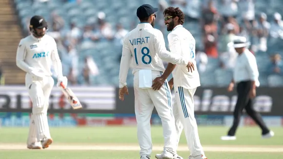 India's Ravindra Jadeja celebrates with Virat Kohli after taking the wicket of New Zealand's Tom Blundell on the third day of the second test cricket match between India and New Zealand, at the Maharashtra Cricket Association Stadium, in Pune, Saturday, Oct. 26, 2024
