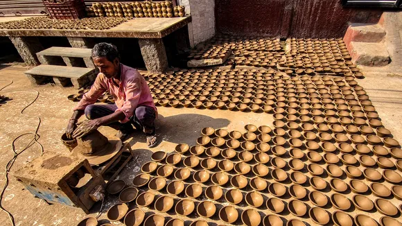 A potter makes 'diyas' ahead of Diwali festival, in Ajmer, Friday, Oct 25, 2024.