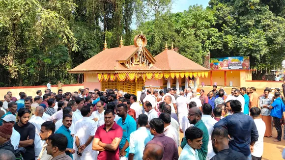 People gather at the fire accident spot at the Anjootambalam Veererkavu Temple at Neeleswaram in Kasaragod district, Tuesday, Oct. 29, 2024.