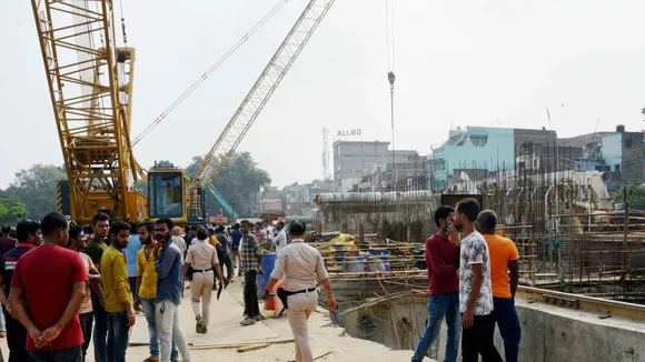 People gather at Patna Metro tunnel construction site where three people died and many injured after they were buried under soil, at Patna Science College NIT more, in Patna Tuesday, Oct. 29, 2024.
