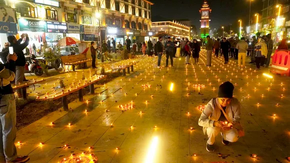 People light 'diyas' during the Diwali festival celebration, at Lal Chowk in Srinagar, Thursday, Oct 31, 2024.