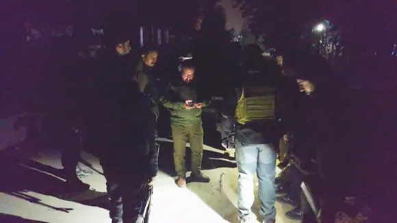 Security personnel conduct investigation after two persons from Uttar Pradesh were shot at by militants, in Jammu and Kashmir's Budgam district, Friday, Nov 1, 2024.