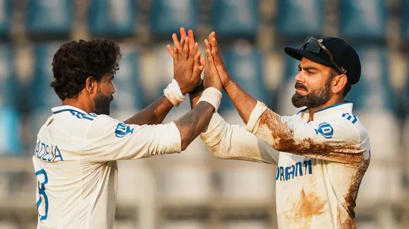 Ravindra Jadeja celebrates with Virat Kohli after taking the wicket of New Zealand's Matt Henry on the second day of the third test cricket match between India and New Zealand, at the Wankhede Stadium, in Mumbai, Saturday, Nov. 2, 2024.