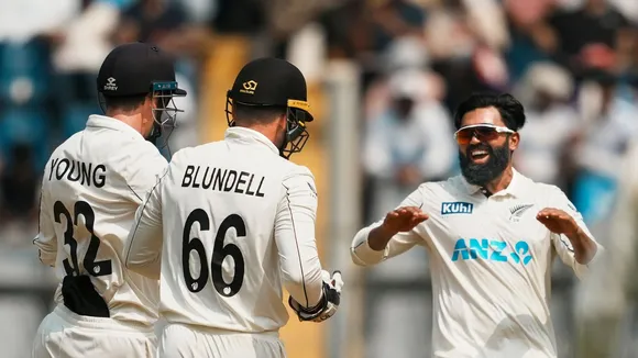 Ajaz Patel celebrates with teammates after taking the wicket of India's Sarfaraz Khan on the second day of the third test cricket match between India and New Zealand, at the Wankhede Stadium, in Mumbai, Saturday, Nov. 2, 2024.